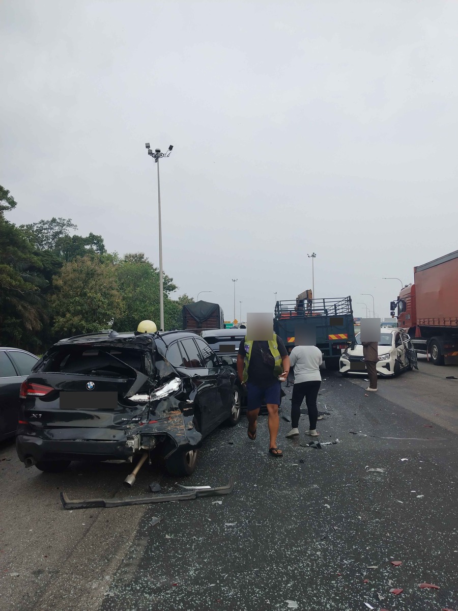 The car after the accident; number plates and bystanders have been obscured for privacy